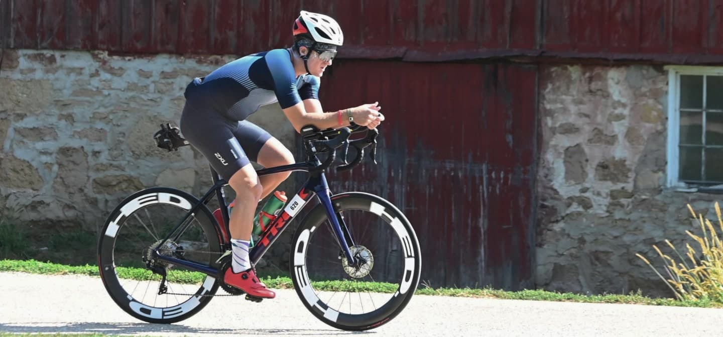 Sam Pausha riding his bike in the Madison Ironman